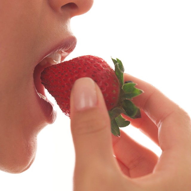 Woman Eating Strawberry